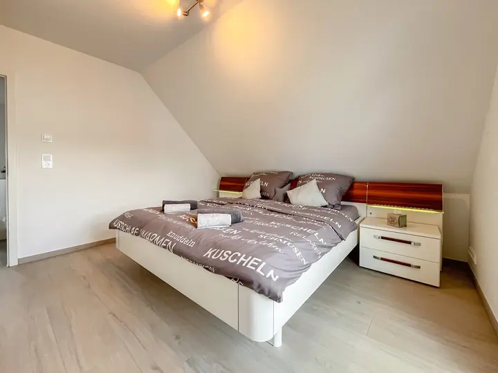 Spacious main bedroom viewed from the side